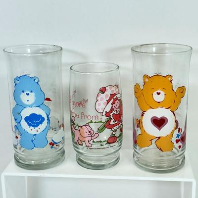 LOT 180: Collectible Glasses: Camp Snoopy, Strawberry Short Cake & Pizza Hut Care Bears: Grumpy & Tenderheart
