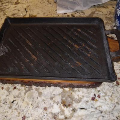Cast iron griddle with wood cutting board