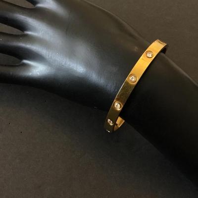 Gold tone locking bracelet