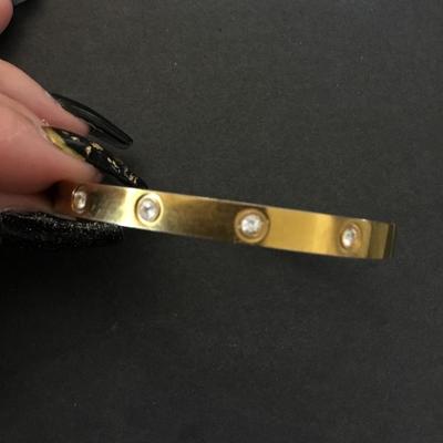Gold tone locking bracelet