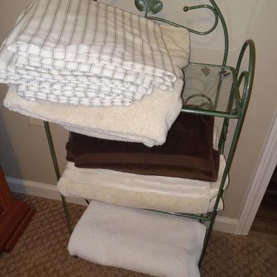 Metal shelf with towels