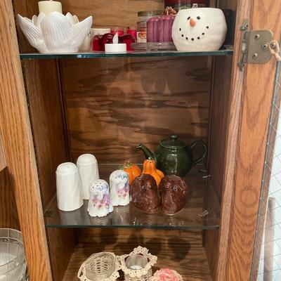 Candles and salt and pepper shakers, along with some crocheted decor