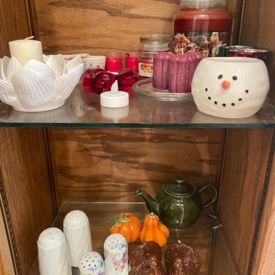 Candles and salt and pepper shakers, along with some crocheted decor