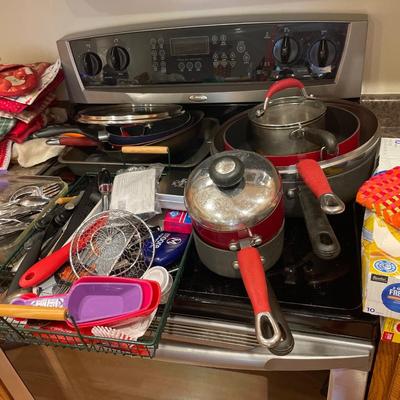 Pots, some silverware and kitchen utensils