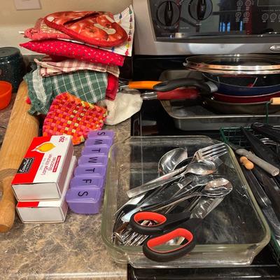Pots, some silverware and kitchen utensils