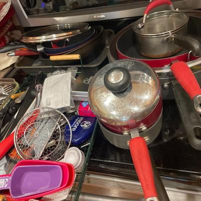 Pots, some silverware and kitchen utensils