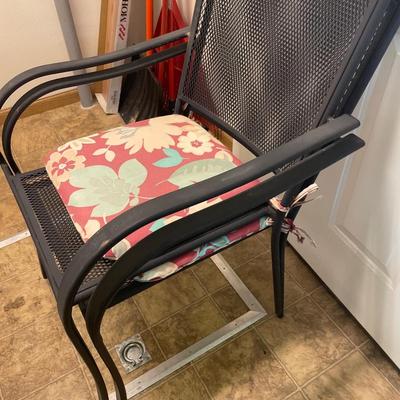 2 black metal chairs