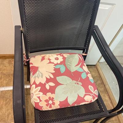 2 black metal chairs