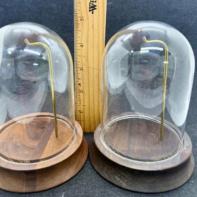 Sale Photo Thumbnail #573: Round wooden base with a brass post with hook, to display a pocket watch, handing ornament, or mother item,  Clear glass dome cover, which is removable. Good condition, approx. 5" tall overall.
