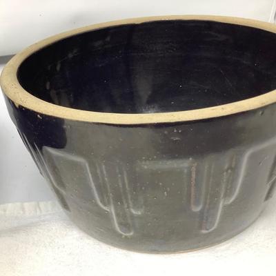 Sale Photo Thumbnail #42: You get two pottery mixing/ serving bowls.  Brown and blue in good condition.  Blue one has USA marked on bottom.
