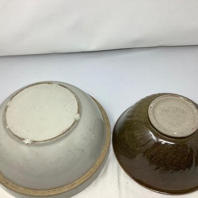Sale Photo Thumbnail #51: You get two pottery mixing / serving bowls.  Gray and brown both in good condition. Brown one is signed by the potter.