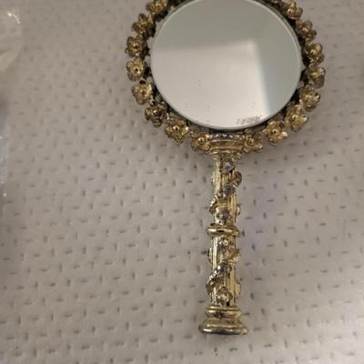 Feminine Variety, small handheld mirror needs bead repair.