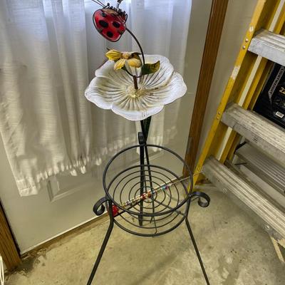 Plant stand with ladybug decor