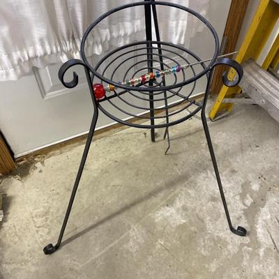 Plant stand with ladybug decor