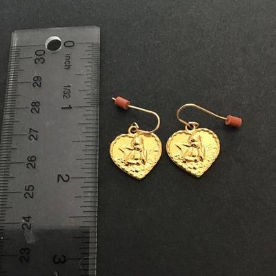 Gold tone cherub dangle earrings