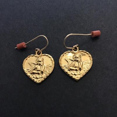 Gold tone cherub dangle earrings