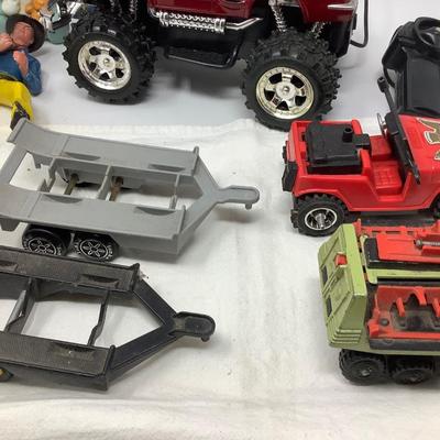 Sale Photo Thumbnail #105: 2 Tonka trailers, Jeep, Matchbox Car, Remote control truck, Mickie, Cowboy