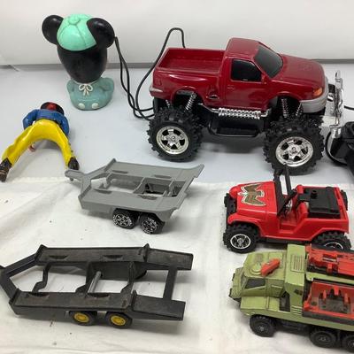 Sale Photo Thumbnail #107: 2 Tonka trailers, Jeep, Matchbox Car, Remote control truck, Mickie, Cowboy