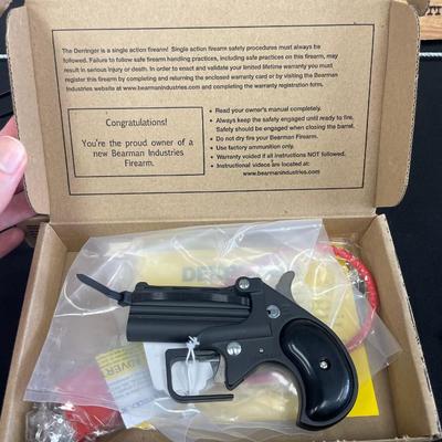 Sale Photo Thumbnail #131: Action: Single-action over/under derringer

Barrel Length: 2.75 inches

Overall Length: 4.65 inches

Height: Approximately 3 inches

Width: Approximately 1 inch

Weight: 14 oz

Capacity: 2-round double-barrel

Frame Material: Alloy

Sights: Fixed front bl