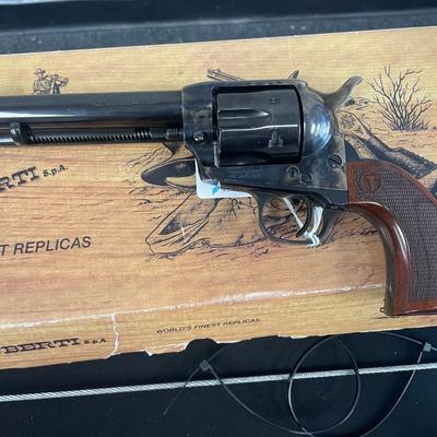 Sale Photo Thumbnail #139: Exclusively from Taylor's, the Smoke Wagon™ is an improved second generation, stagecoach style single action revolver. This Smoke Wagon™ model features a forged case hardened steel frame, blued steel parts, a checkered Navy size grip with a thinner pr
