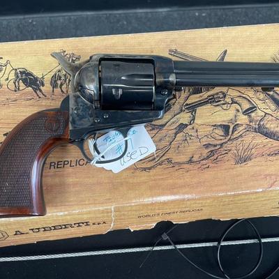 Sale Photo Thumbnail #140: Exclusively from Taylor's, the Smoke Wagon™ is an improved second generation, stagecoach style single action revolver. This Smoke Wagon™ model features a forged case hardened steel frame, blued steel parts, a checkered Navy size grip with a thinner pr