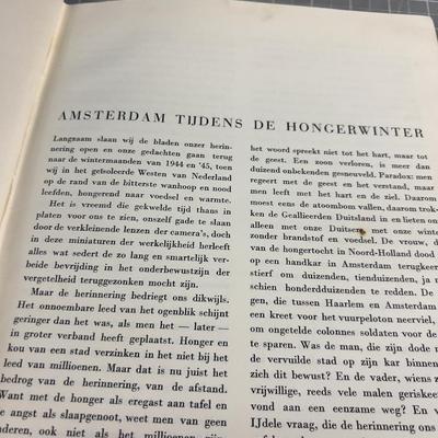 Sale Photo Thumbnail #162: Published only two years after Holland’s liberation from the Nazis, with over a 100 photos and an introduction by Max Nord..."AMSTERDAM tijdens de hongerwinter 1944-45" (AMSTERDAM during the hunger winter 1944-45)...Detailing the harsh winter and Gaeman
