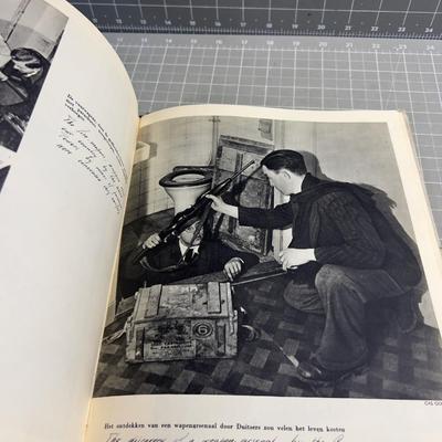 Sale Photo Thumbnail #164: Published only two years after Holland’s liberation from the Nazis, with over a 100 photos and an introduction by Max Nord..."AMSTERDAM tijdens de hongerwinter 1944-45" (AMSTERDAM during the hunger winter 1944-45)...Detailing the harsh winter and Gaeman