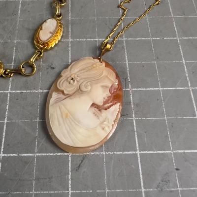 Sale Photo Thumbnail #542: Interesting. The Pendant seems much older that the other item. 