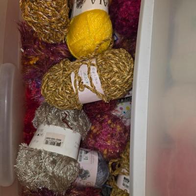 Storage bin packed with yarns