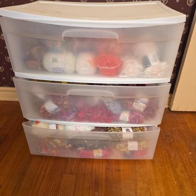 Storage bin packed with yarns