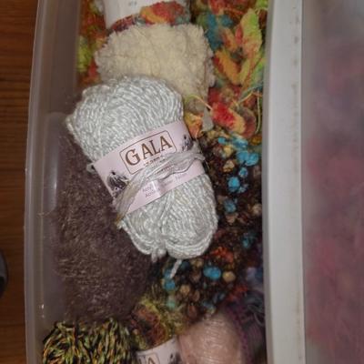 Storage bin packed with yarns