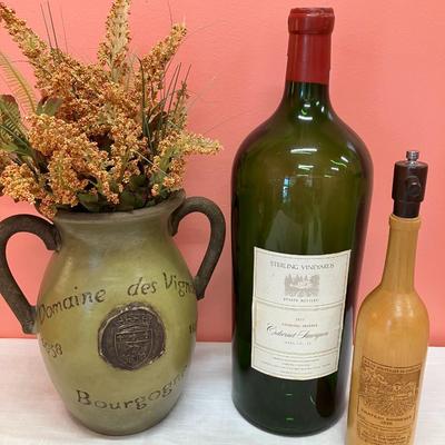 Sale Photo Thumbnail #25: 3 items: 1 oversized glass wine bottle, 1 pottery vase, 1 wooden carved wine bottle. Great decor pieces.