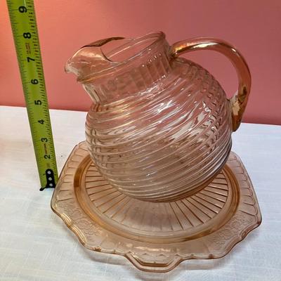Sale Photo Thumbnail #33: 2 pieces: Pink depression glass pitcher and footed platter