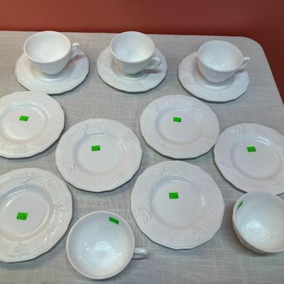 Sale Photo Thumbnail #55: Set of same pattern milk glass items, containing: 6 small plates, 5 cups, 3 saucers, all in excellent condition