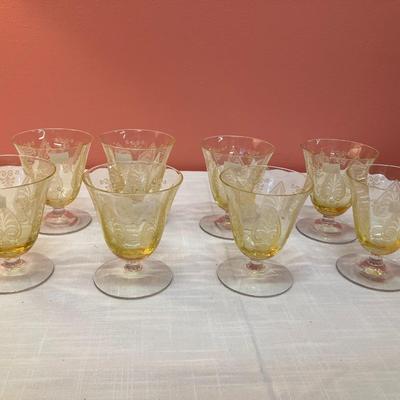 Sale Photo Thumbnail #67: Amazing pieces of Trojan Topaz designed Fostoria glassware, produced 1929-1936. Gorgeous yellow topaz color and clarity. Some pieces may have minor chips due to age. Gorgeous etched design. 
Set includes: 8 oyster/fruit cocktail glasses