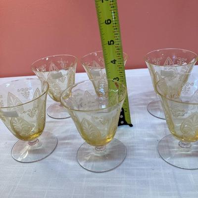 Sale Photo Thumbnail #69: Amazing pieces of Trojan Topaz designed Fostoria glassware, produced 1929-1936. Gorgeous yellow topaz color and clarity. Some pieces may have minor chips due to age. Gorgeous etched design. 
Set includes: 8 oyster/fruit cocktail glasses