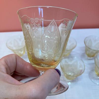 Sale Photo Thumbnail #68: Amazing pieces of Trojan Topaz designed Fostoria glassware, produced 1929-1936. Gorgeous yellow topaz color and clarity. Some pieces may have minor chips due to age. Gorgeous etched design. 
Set includes: 8 oyster/fruit cocktail glasses
