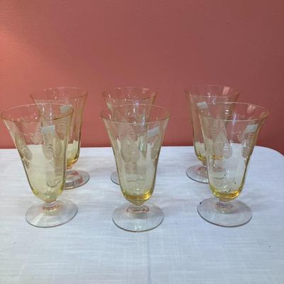 Sale Photo Thumbnail #77: Amazing pieces of Trojan Topaz designed Fostoria glassware, produced 1929-1936. Gorgeous yellow topaz color and clarity. Some pieces may have minor chips due to age. Gorgeous etched design. 
Set includes: 6 footed tumblers
