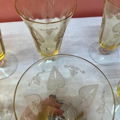 Sale Photo Thumbnail #81: Amazing pieces of Trojan Topaz designed Fostoria glassware, produced 1929-1936. Gorgeous yellow topaz color and clarity. Some pieces may have minor chips due to age. Gorgeous etched design. 
Set includes: 6 footed tumblers