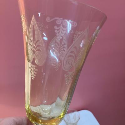 Sale Photo Thumbnail #80: Amazing pieces of Trojan Topaz designed Fostoria glassware, produced 1929-1936. Gorgeous yellow topaz color and clarity. Some pieces may have minor chips due to age. Gorgeous etched design. 
Set includes: 6 footed tumblers