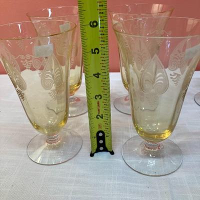 Sale Photo Thumbnail #79: Amazing pieces of Trojan Topaz designed Fostoria glassware, produced 1929-1936. Gorgeous yellow topaz color and clarity. Some pieces may have minor chips due to age. Gorgeous etched design. 
Set includes: 6 footed tumblers