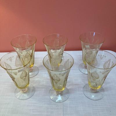Sale Photo Thumbnail #78: Amazing pieces of Trojan Topaz designed Fostoria glassware, produced 1929-1936. Gorgeous yellow topaz color and clarity. Some pieces may have minor chips due to age. Gorgeous etched design. 
Set includes: 6 footed tumblers