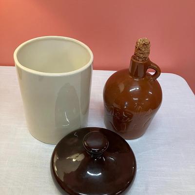Sale Photo Thumbnail #104: Set includes 2 pieces: 1 House of Webster, TX vintage whiskey jug with corn cob stopper and 1 unmarked pottery canister