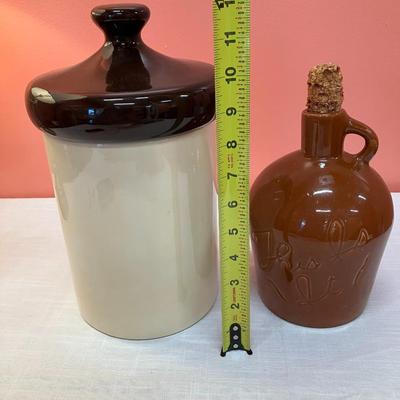 Sale Photo Thumbnail #103: Set includes 2 pieces: 1 House of Webster, TX vintage whiskey jug with corn cob stopper and 1 unmarked pottery canister