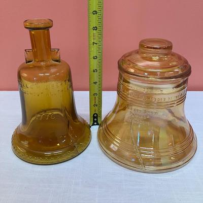 Sale Photo Thumbnail #206: 1976 Bicentennial Liberty Bell liquor decanter and cookie jar. Decanter is amber colored glass. Cookie jar is amber colored glass with an iridescent finish.
