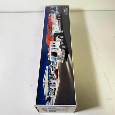 LOT 125: Collection of New Hess Trucks in Box