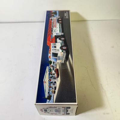 LOT 125: Collection of New Hess Trucks in Box