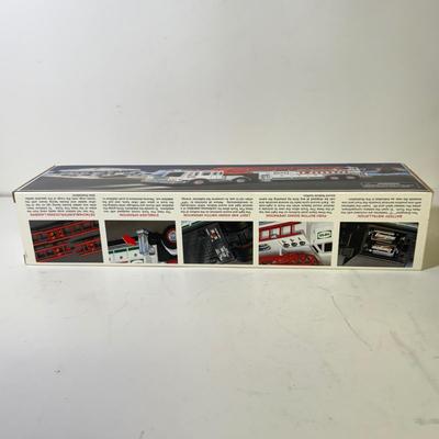 LOT 125: Collection of New Hess Trucks in Box