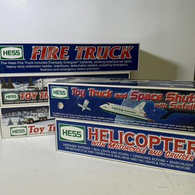 LOT 125: Collection of New Hess Trucks in Box