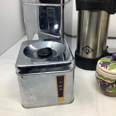 Sale Photo Thumbnail #137: Two metal canisters, nice thermos, large tin, and jam holder